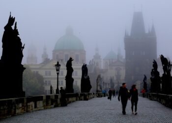 best european cities to visit in january: a quiet, frosty city square at dawn